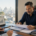 Los Angeles business owner reviewing merchant cash advance debt and payment options with a financial advisor